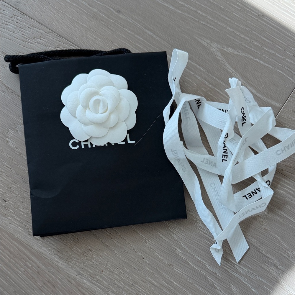 CHANEL Black Bag with White Camellia and Ribbons